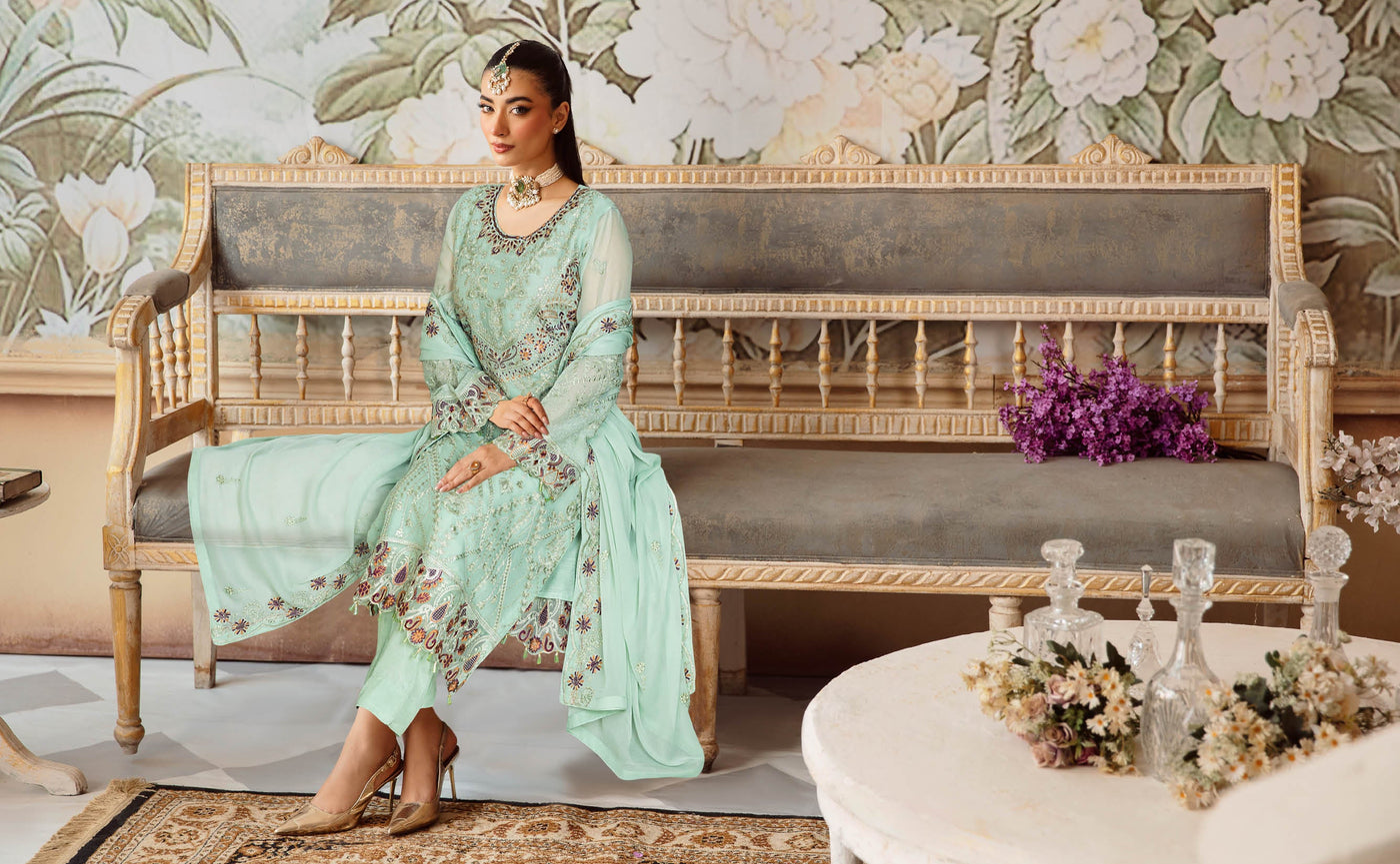 Mint embroidered Sangeet outfit photographed in a floral interior